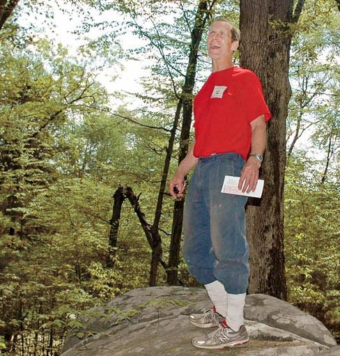 Randy Tuomisto, president of the Cumberland Land Trust, checks the supply of trail
