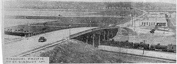 The bridge was completed September 27, 1934. The Cost: $600,000.00. The Fairfax Bridge built of steel and concrete is 2486 1/2 feet long; 55 feet above the water. It has 13 spans resting on 14 piers.