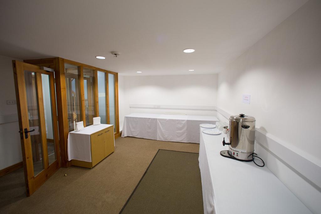 First floor Function room, dimensions 16 x 10 feet. Kitchenette with fridge and sink, and equipped with white crockery for up to 30 people. Two unisex toilets 1.