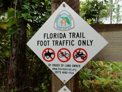 TITLE: Florida National Scenic Trail Unauthorized Uses w/fnst logo (8 x 8 ) CLASS: Regulatory PURPOSE / USE: Identifies Florida Trail, permitted uses and provides limited FTA contact