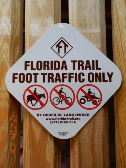 TITLE: Florida National Scenic Trail Unauthorized Uses w/fta logo (7 ¾ x 7 ¾ ) CLASS: Regulatory PURPOSE / USE: Identifies Florida Trail, permitted uses and provides limited FTA contact information.