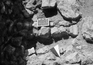 Fig. 42 - Boat-shaped grave. stones, while the corner made from two external walls of the buildings formed another part of the circle.