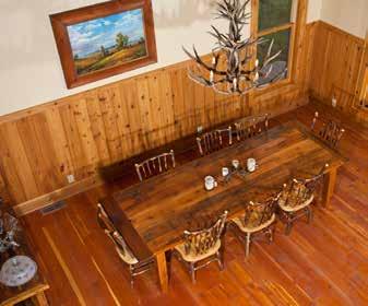 The pine floors, fir and knotty pine beams and paneling and large river rock fireplace fit well with the environment.