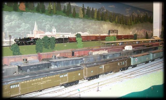 The railroad is remotely controlled by Aristocraft transmitters similar to our modular layout. For operating sessions it has fast clocks and waybills.