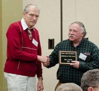 sending this photo of Bill DeFoe (left) receiving his Modeler of the Year plaque from recently retired B n B coordinator Paul Gallick.