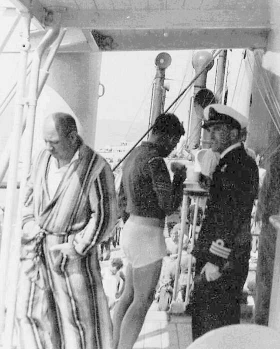 The Commander (E) of HMS Defender, Dick Hart, was also a passenger and here he is on the deck of the Socotra with two other survivors.
