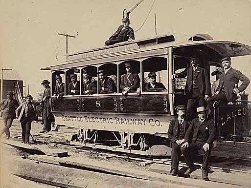 8. Getting There Motormen pose with a Seattle Electric Railway trolley. The city s first streetcar and railroad connected Lake Union to downtown.