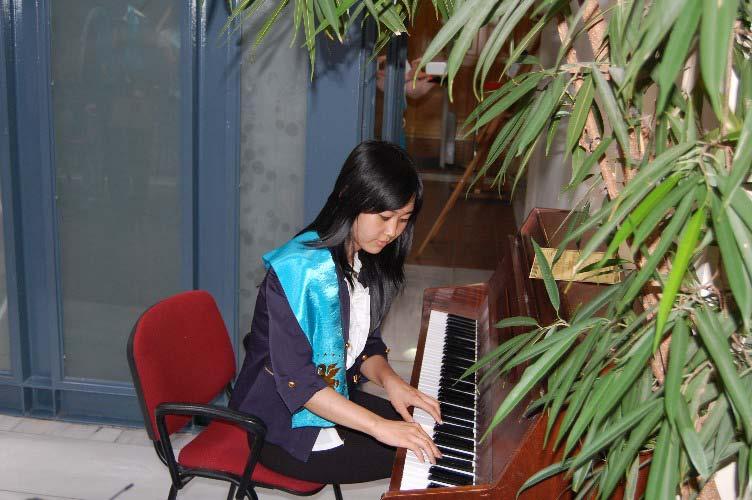 The student Victoria Lim plays some of