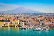 Catania lies in a delightful geographical position between the Ionian Sea and the slopes of Mount Etna. Sicily s second city has always had a close relationship with the volcano.
