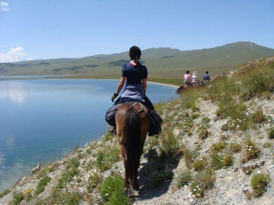 This gives both you and the horses a chance to rest. After lunch, mount up and ride along the fields above Kizart.