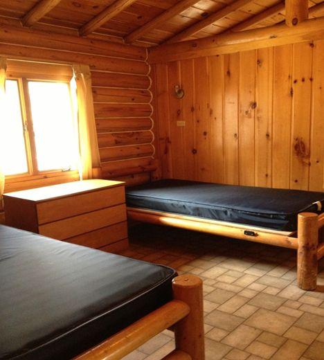 8 campers sleep in a cabin Each cabin has a bathroom, with 1 shower and 2 sinks Each camper will sleep in a twin bed near another camper ( bunk mate ) A sheet,