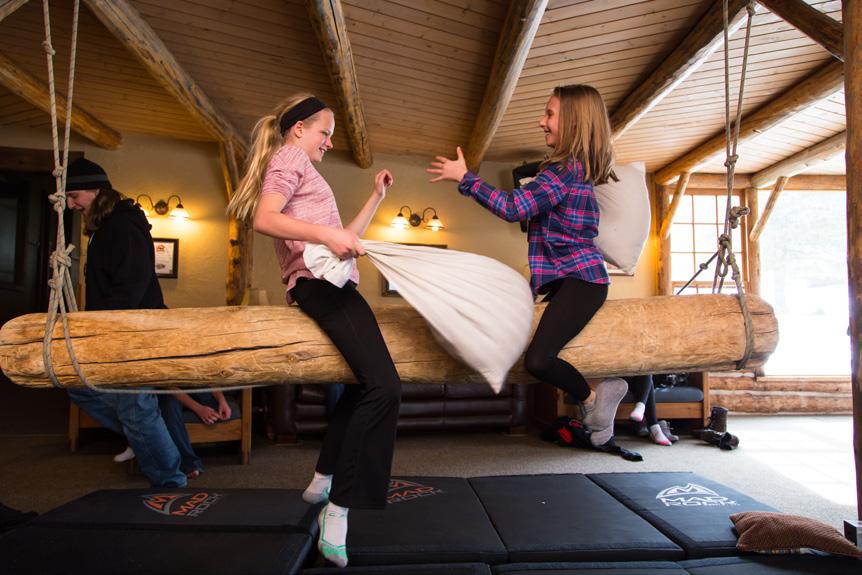 Participants will take turns using pillows to try to knock one another off of this classic Sky Ranch Horn Creek activity.