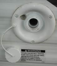 Disconnect the non-toxic drinking water hose and reinstall the connection cap. The connection cap should always be installed if the water fill is not in use.