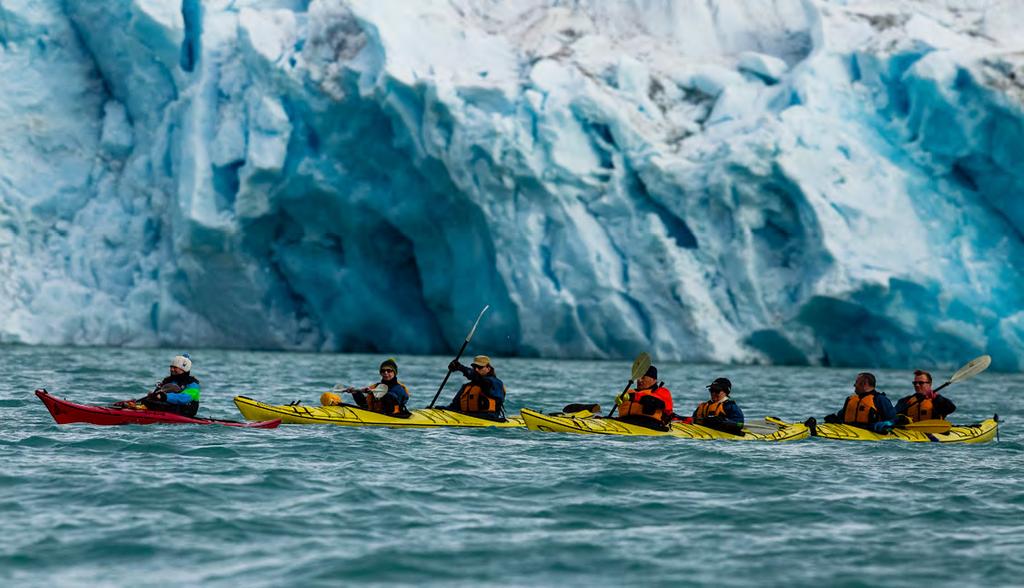 Paid Activities SEA KAYAKING Imagine gliding across the surface of a bay in the presence of icebergs and glaciers.