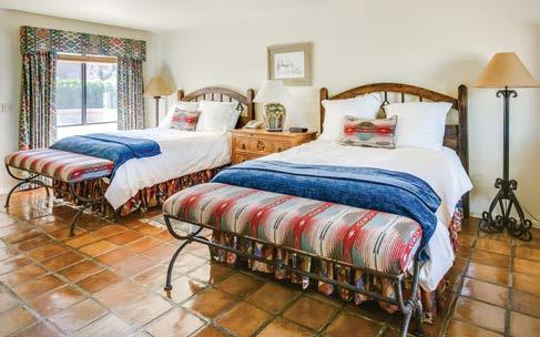 configuration. The warm Southwestern colors of these rooms are complemented by elegant hand-crafted furniture, for a rustic and charming Old West feel.
