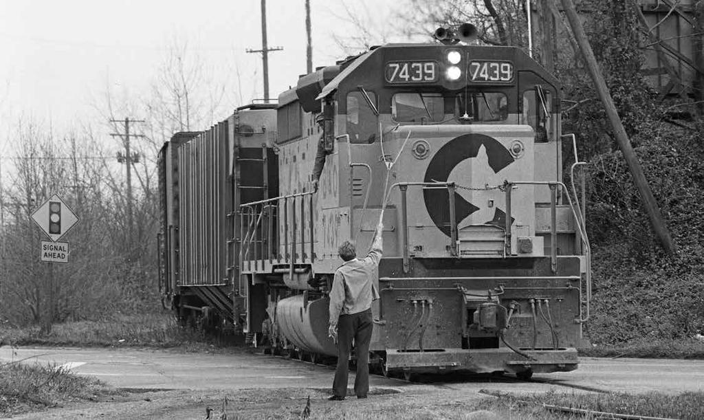 The engineer of B&O train Hamilton 97 is about to get train orders from Red Surber, the operator at Tates Point Tower on the east side of Dayton, Ohio.