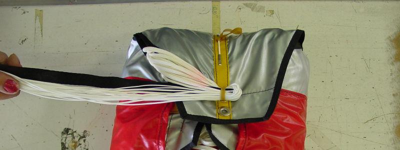 Z-Fold the ¼ nylon portion of the parachute lines on top of the