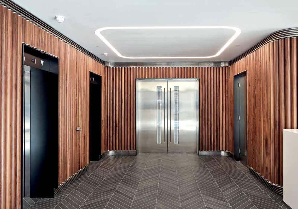 A dramatic light feature is suspended above the reception hall