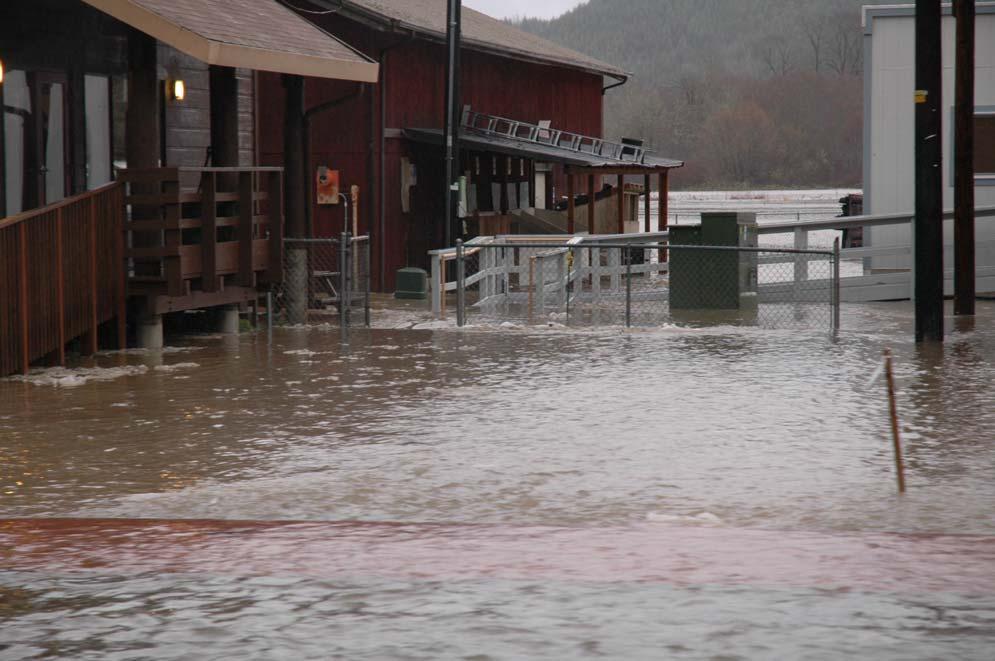 Monday, 12/03/07: Flood waters in corridor between Tribal Administrative Building (left foreground), Legal