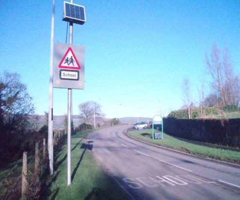 B49 Donemana Primary School Install warning signs with Complete Longland Road, Donemana flashing lights and associated carriageway markings. 3.