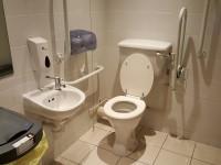 There is not a shelf next to the toilet. The toilet has a lid. The height of the toilet seat above oor level is 49cm (1ft 7in). There is a toilet roll holder.