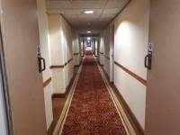 There is some ooring in corridors/walkways which is shiny and could cause issues with glare or look slippery to some