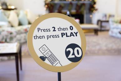 The disc signs throughout the tour advise visitors which numbers to press on their audio handset tour and signify the