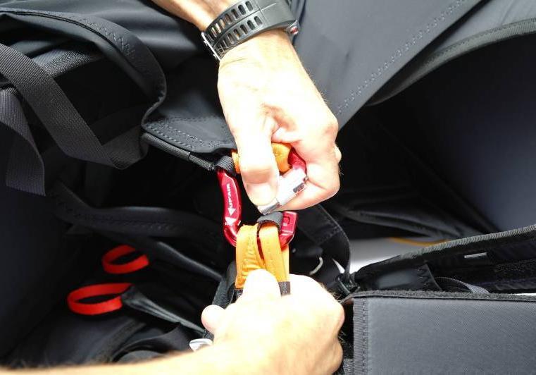 The back pocket can easily hold the paraglider s backpack,