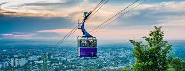 It is connected to downtown Almaty by a cable car line.