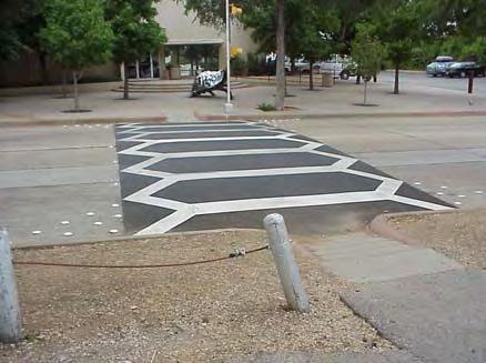 Care should be taken to keep vegetation and other obstacles out of the sight Raised Crosswalk line for motorists and trail users.