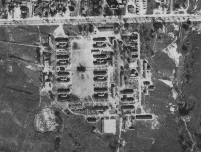 Indoor Range Aerial Photograph of Soldiers Camp/Toronto Emergency Housing, 1954. Physical Description The subject property is west of Marie Curtis Park and south of the Small Arms Building.