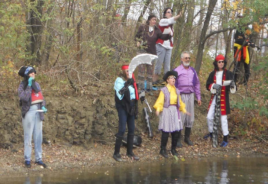 The motley crew of pirates haunting Lake Arthur during a Halloween paddle hosted by Paul
