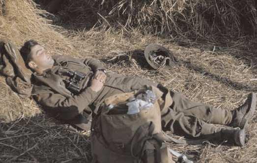 Left: the Fifth Army in Lauro, Italy, Jan 19 1944. Lieutenant Olaf Branns sleeps in a haystack during a lull in the battle.
