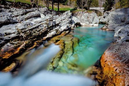 Emerald blue-green water against grey limestone is the signature feature of the Soča River, which cut a spectacular course from its source to the sea.