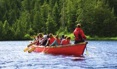 mountain lake in a 37-foot, 20-passenger Alaska Native-style canoe.