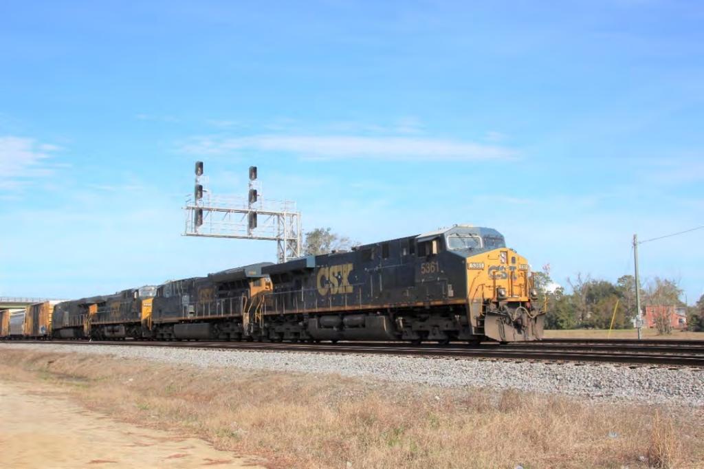 WAYCROSS, GEORGIA AT THE DIAMOND CSXT 5361, an ES40DC; CSXT 3404, an ET44AH; CSXT 235, a CW44AC/H; and CSXT 3008, an ES44AH, lead a manifest freight train south through Waycross.