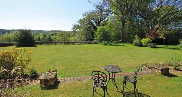 4 acres and comprise both formal and informal areas with sweeping lawns, mature trees, shrubs and woodland.