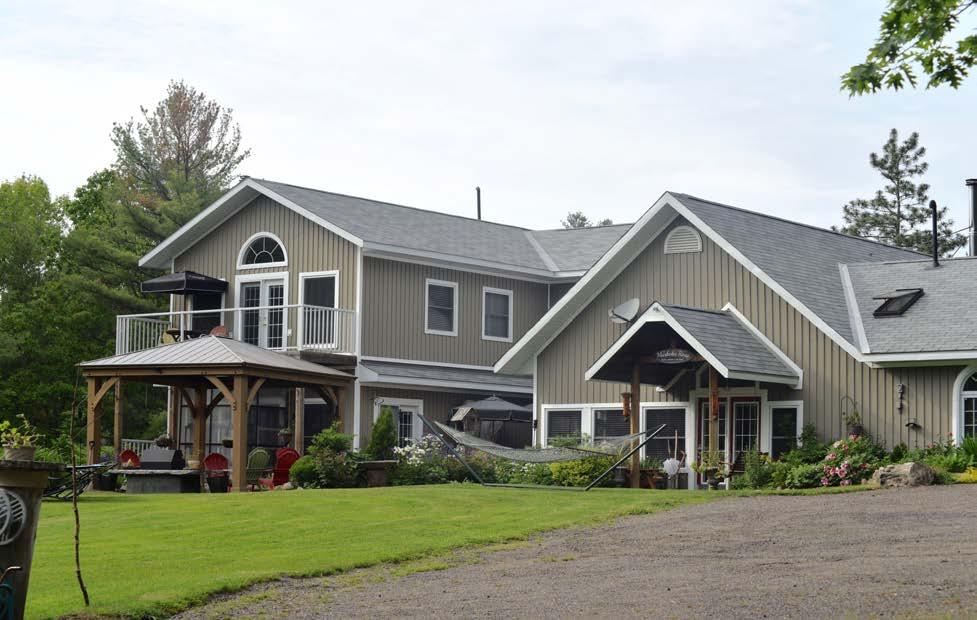 THE GUEST HOUSE The Muskoka Rose resides on Pine Lake and is conveniently located