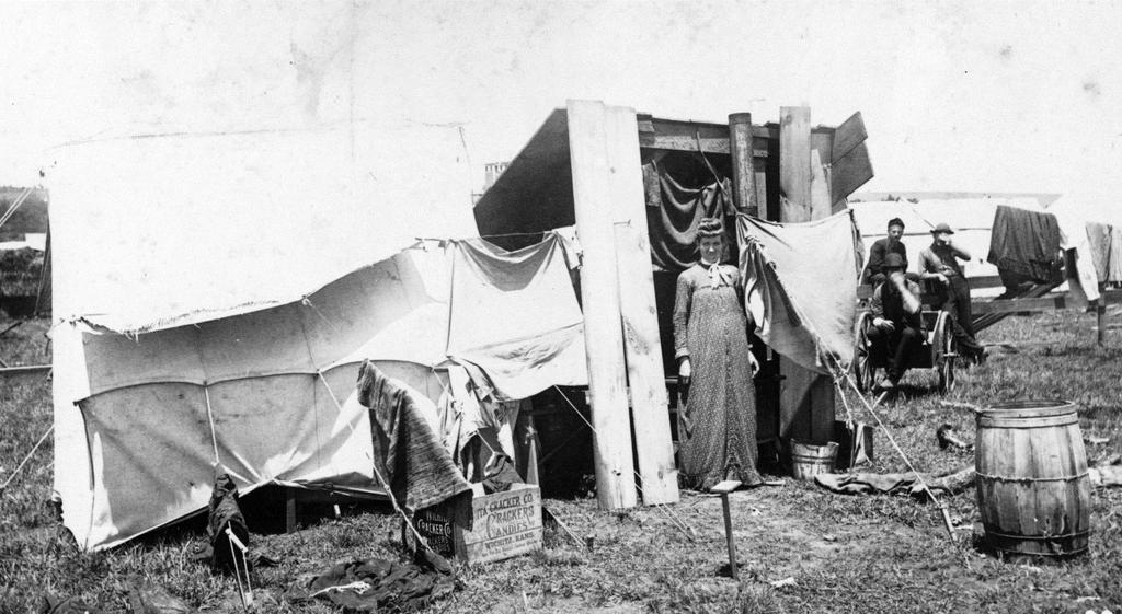 Primary Source: Holding a Claim This photograph shows a woman who has staked a town lot in Guthrie after the 1889 Land Run.