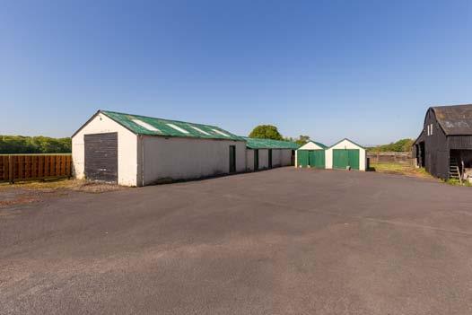 Tractor Shed/stores About 106 x 19 Brick and corrugated iron 2. 2 Garages About 17 4 x 9 Brick, wood and corrugated iron 3. Implement shed About 36 x 35 8 Wood and corrugated iron 4.
