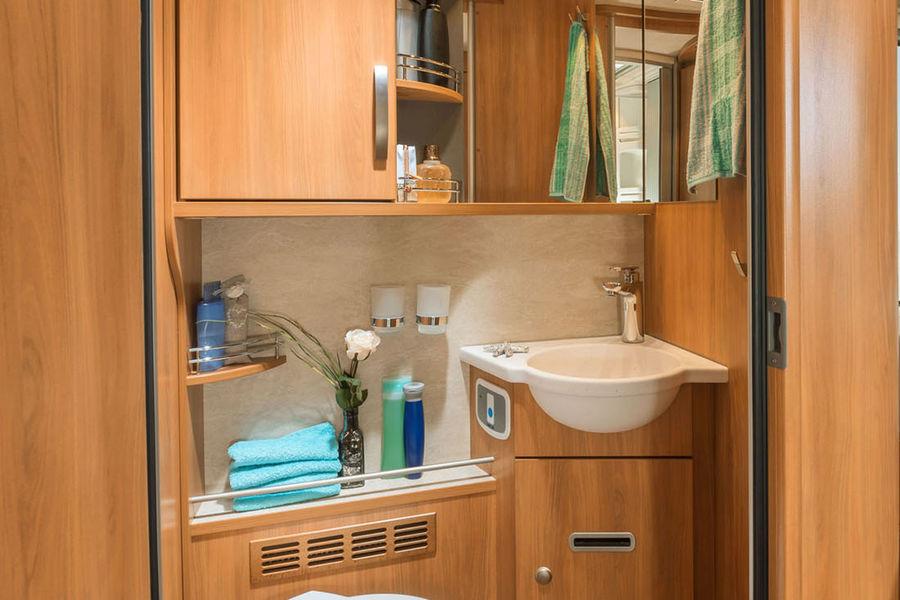 Swing door In the bathroom of the HYMER T-Class SL 704, the toilet can be closed off via a swing door.