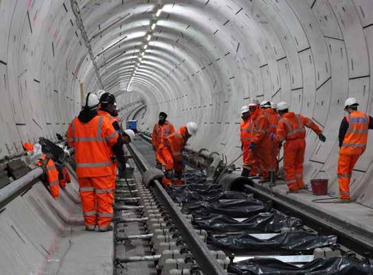 end to all new track installation in the new tunnels. Five different types of track have been installed. Standard track slab forms 80 per cent of tracks in the central section.