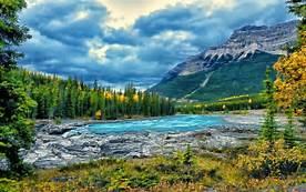 You're sure to agree with the assessment as you travel the Icefields Parkway, a showcase of rushing streams and tumbling waterfalls spanning two of the world's most beautiful parks.
