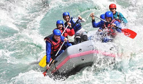 Wildwater Rafting including BBQ Equipped with a neoprene suit, life jacket, helmet and shoes the group fights against the wild