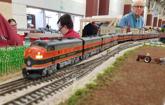 Layout of the Month: AHSOME s New Sectional Layout, con t Page 2 AHSOME president Jeff Golding s Great Northern Empire Builder glides across the grade crossing and into and then past the depot in the