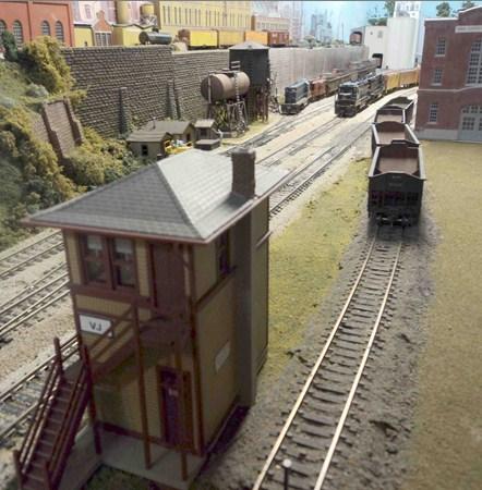 But the Powerhouse is on the right side in the picture, the yard switcher can be seen to the left, and the double track main line is between them.