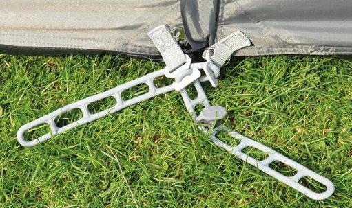 13. Close all zip entrances on the awning s flysheet and peg out the storm straps and guy lines.