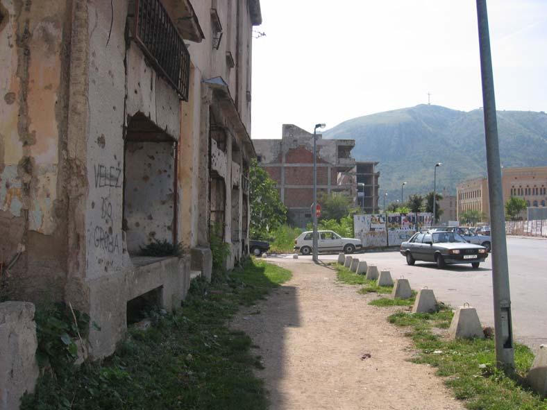 Street in the former frontline, city of Mostar, September 2005 The dividing line of the city is the former main street which became the frontline during the war. Today it looks like this.
