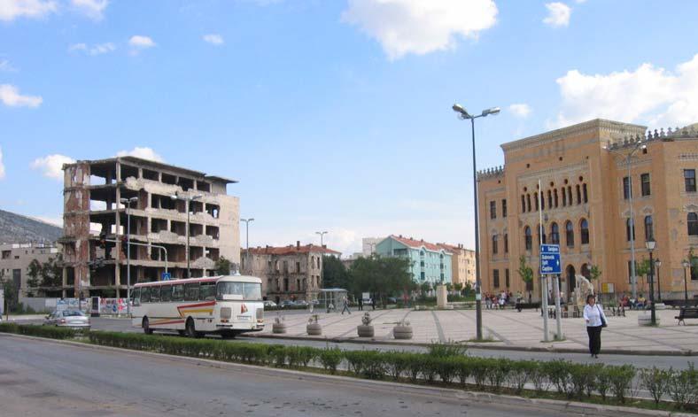 Mostar Gymnasium on the right, the former borderline street on the left, September 2005 The Gymnasium was badly destroyed in the war and the building was also used for shooting.