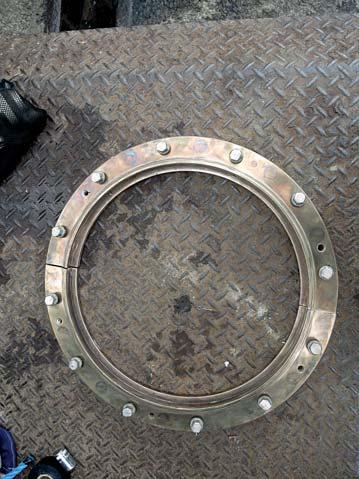 Cleaned split ring prior to reinstallation. Hydrex diver/technician preparing new seal for bonding. secured.